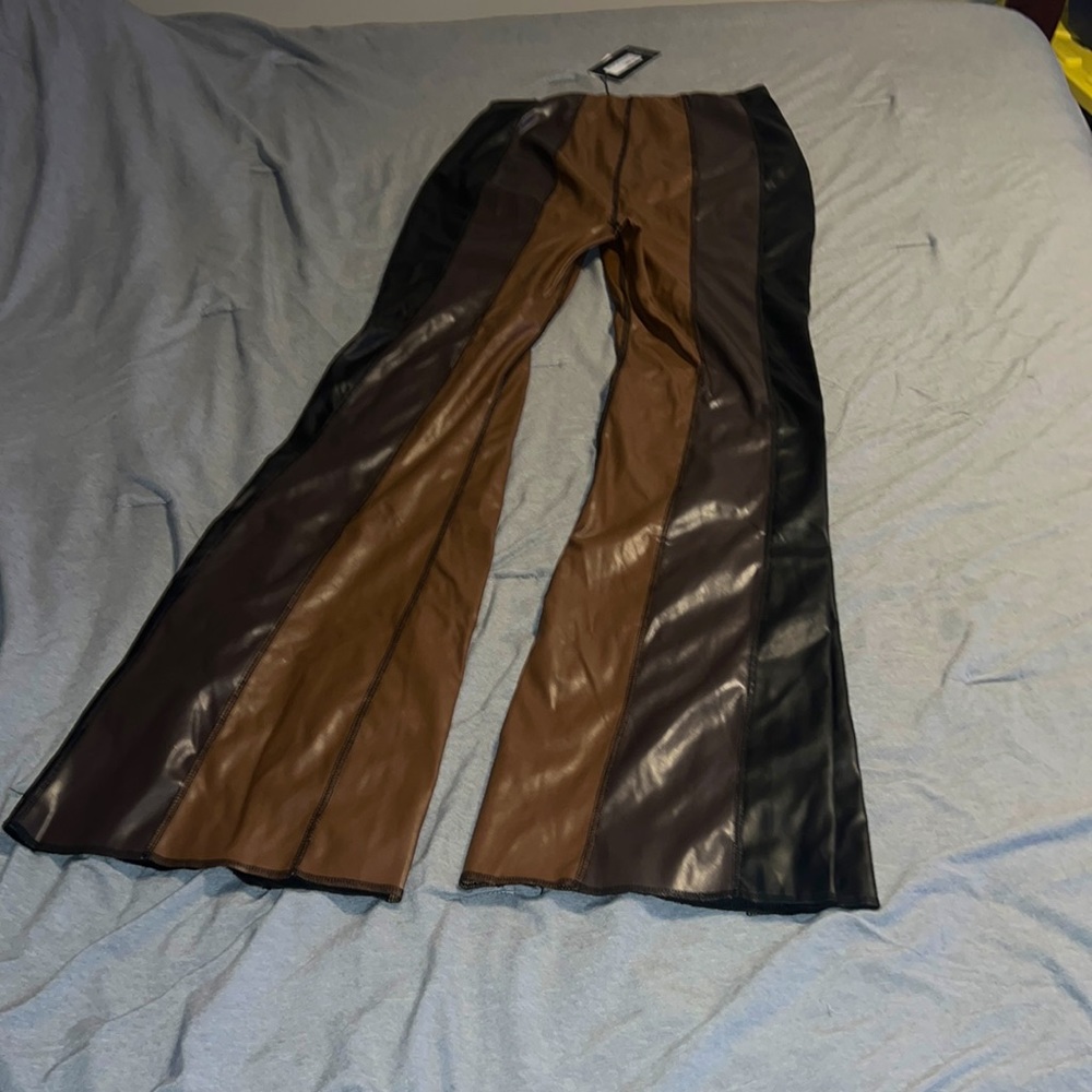 Striped and flared faux leather pants
